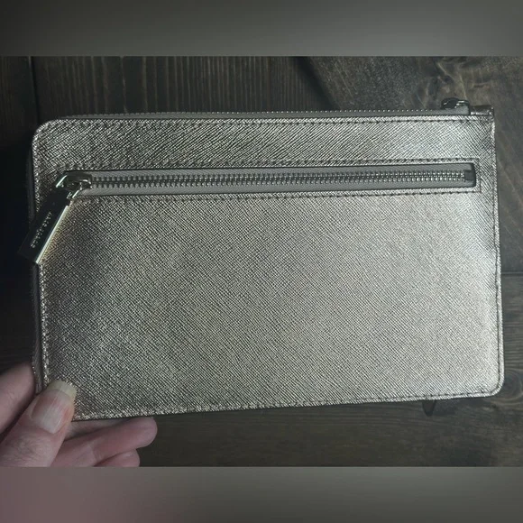 Kate Spade Gold Metallic wristlet
Pre-loved -good condition - Picture 2 of 5